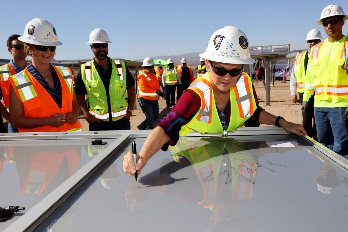 Energy Secretary Jennifer Granholm tours signs a solar module at Townsite solar facility in Bou ...
