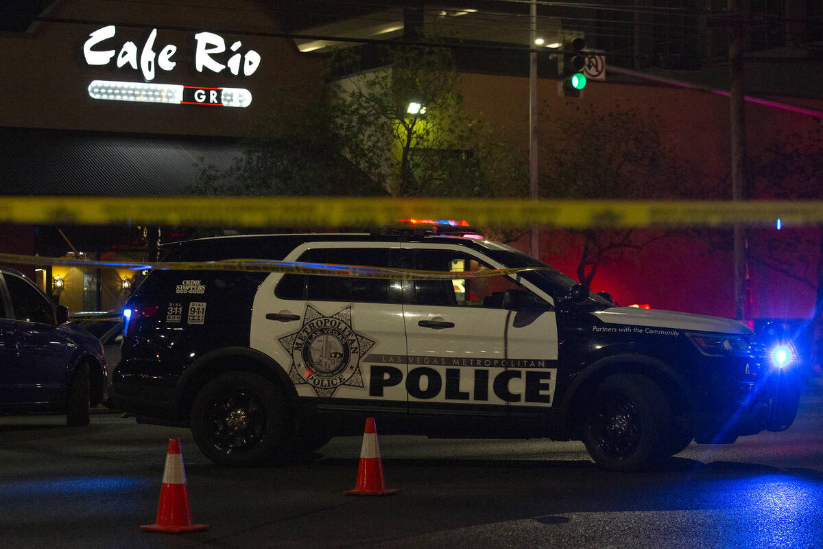 Metropolitan police investigate a homicide at 4680 South Maryland Parkway, across from the UNLV ...