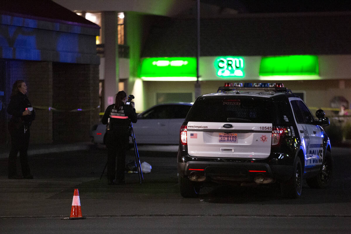 Metropolitan police investigate a homicide at 4680 South Maryland Parkway, across from the UNLV ...