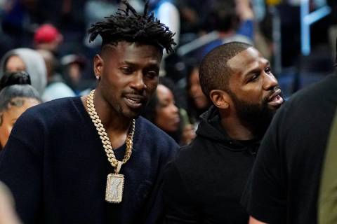 National Football League wide receiver Antonio Brown, left, is seen with boxer Floyd Mayweather ...