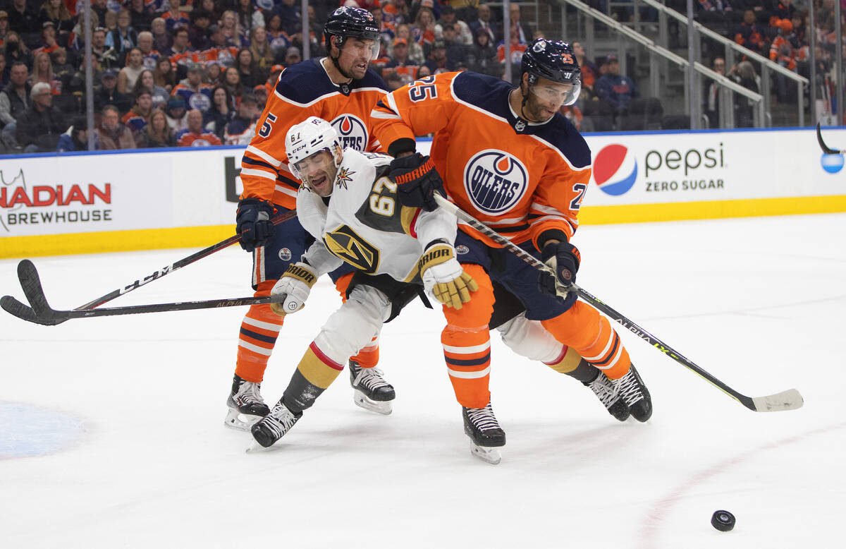 Vegas Golden Knights' Max Pacioretty (67) and Edmonton Oilers' Cody Ceci (5) and Darnell Nurse ...