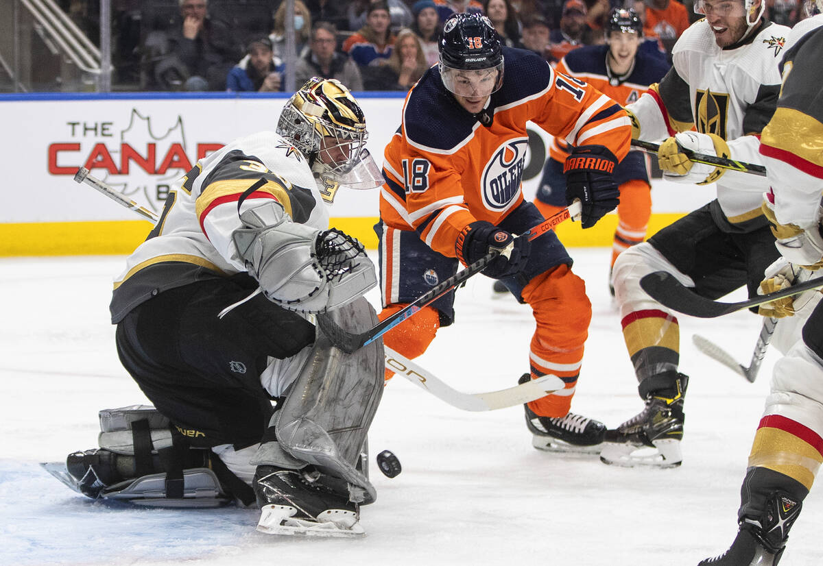 Vegas Golden Knights goalie Logan Thompson (36) makes the save on Edmonton Oilers' Zach Hyman ( ...