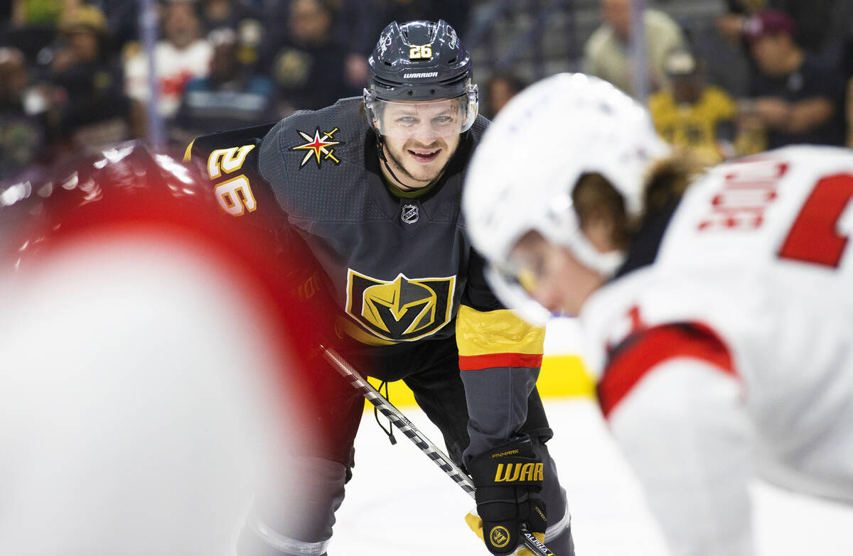 Golden Knights center Mattias Janmark (26) smiles before the puck drops on a face off in the fi ...