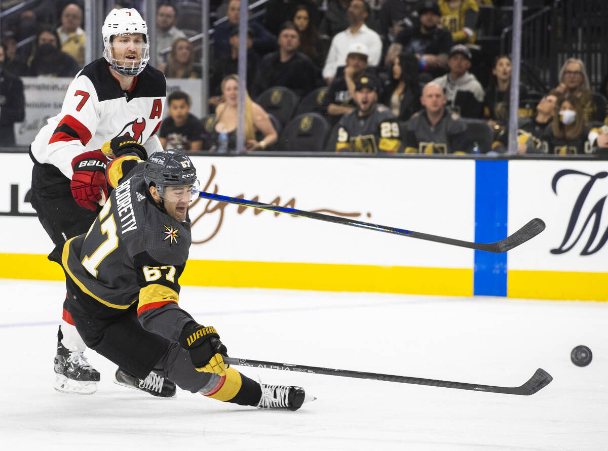 Golden Knights left wing Max Pacioretty (67) is taken down by New Jersey Devils defenseman Doug ...