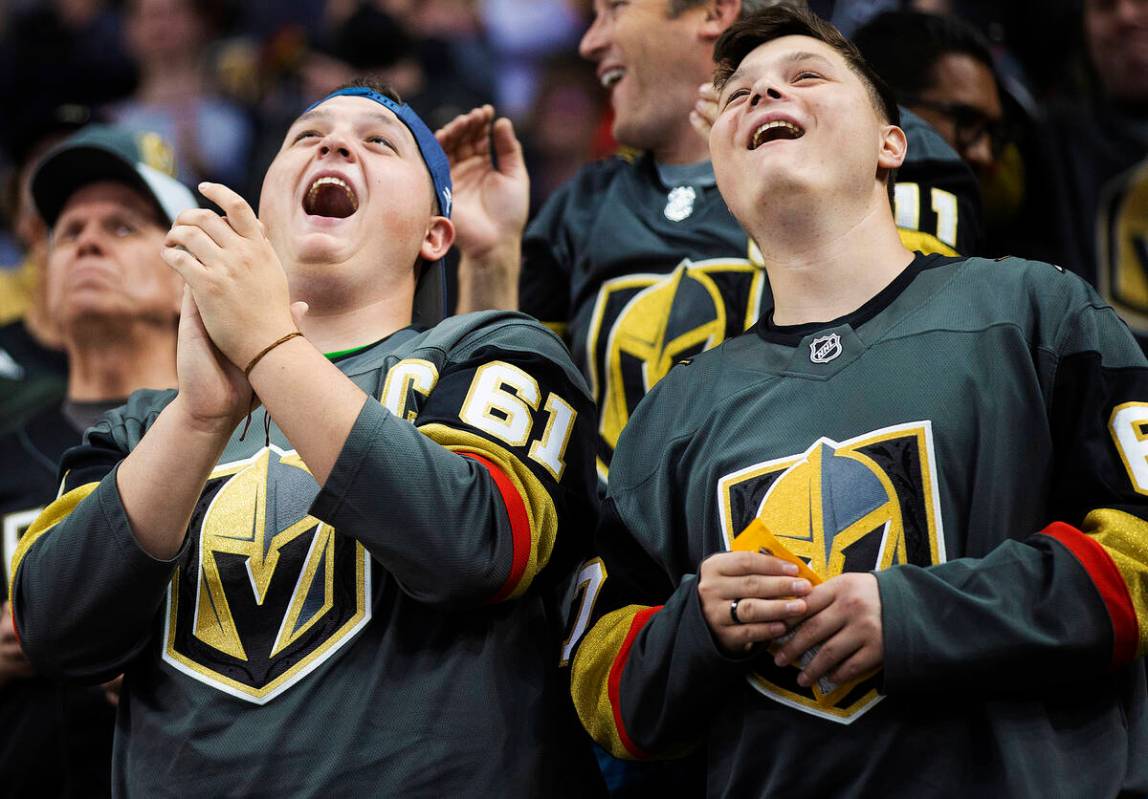 Golden Knights fans cheer for Vegas during an NHL hockey game against the New Jersey Devils on ...