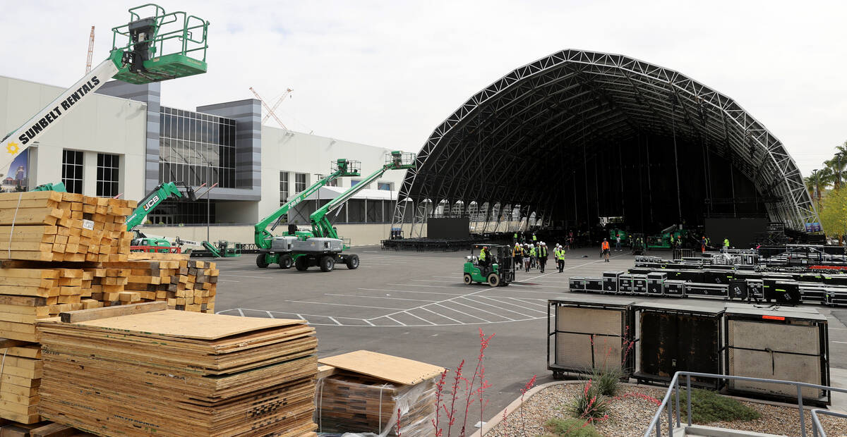 The main stage at the NFL Draft Experience under construction behind The Linq Hotel in Las Vega ...