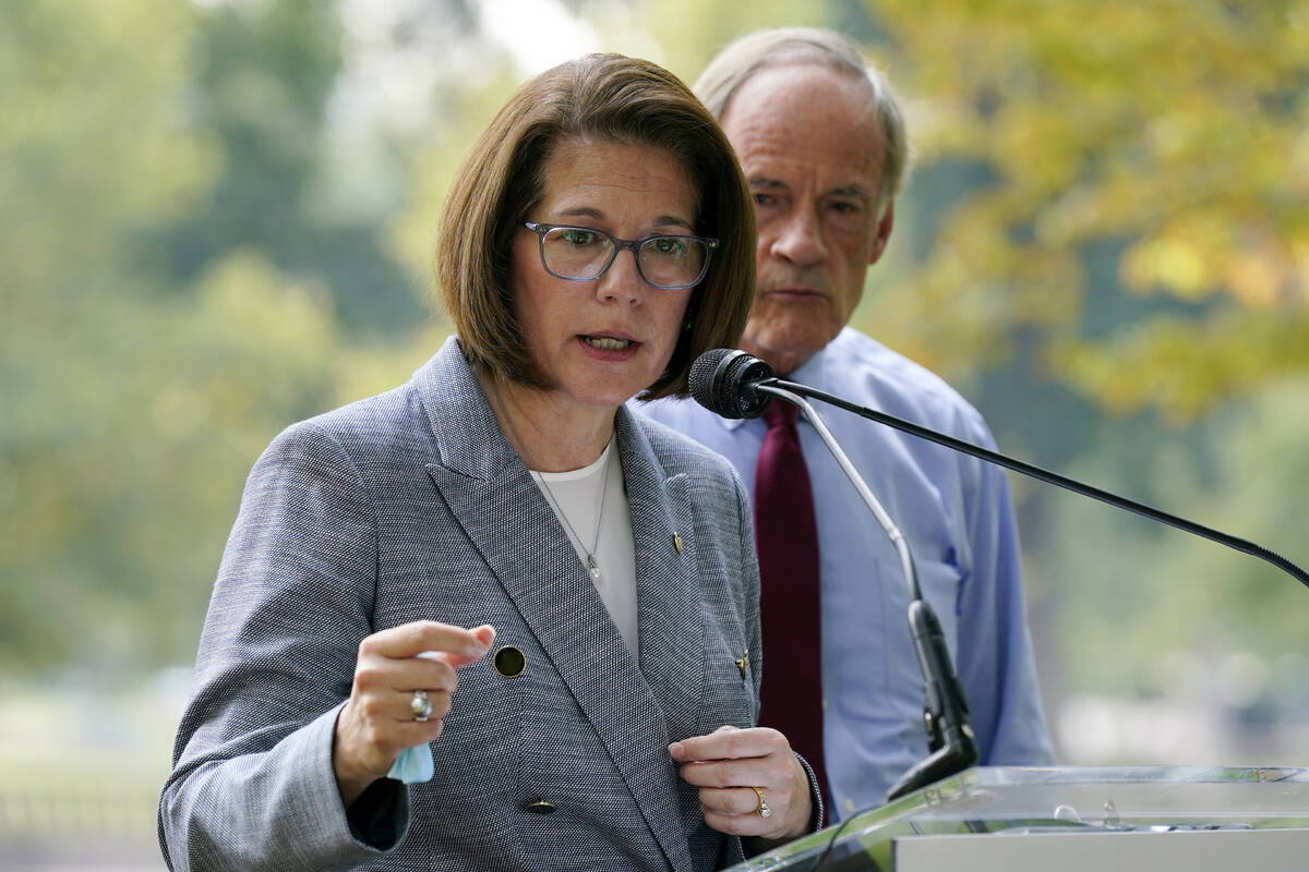 FILE - Sen. Catherine Cortez Masto, D-Nev., left, speaks alongside Sen. Tom Carper, D-Del., at ...