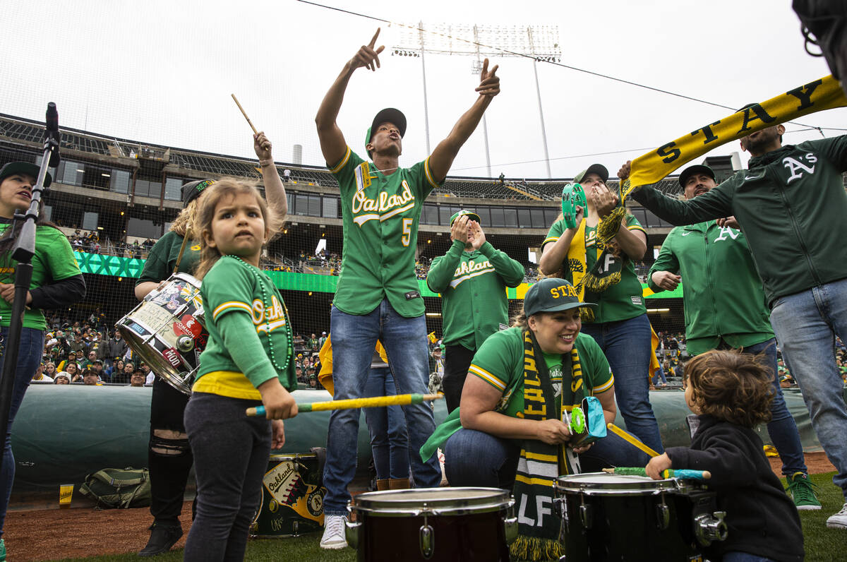 Oakland Athletics fans cheer before the opening night game against the Baltimore Orioles on Mon ...