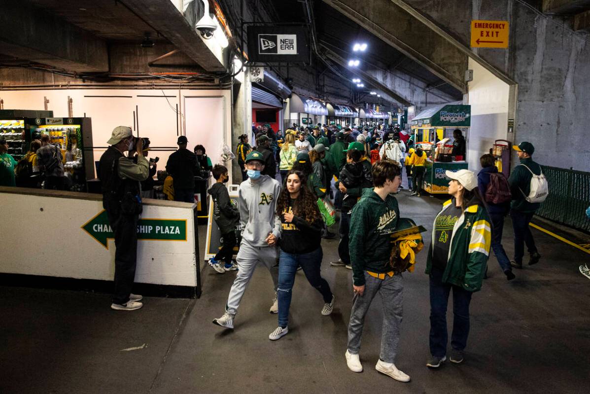 Oakland Athletics fans walk the concourse before the opening night game against the Baltimore O ...