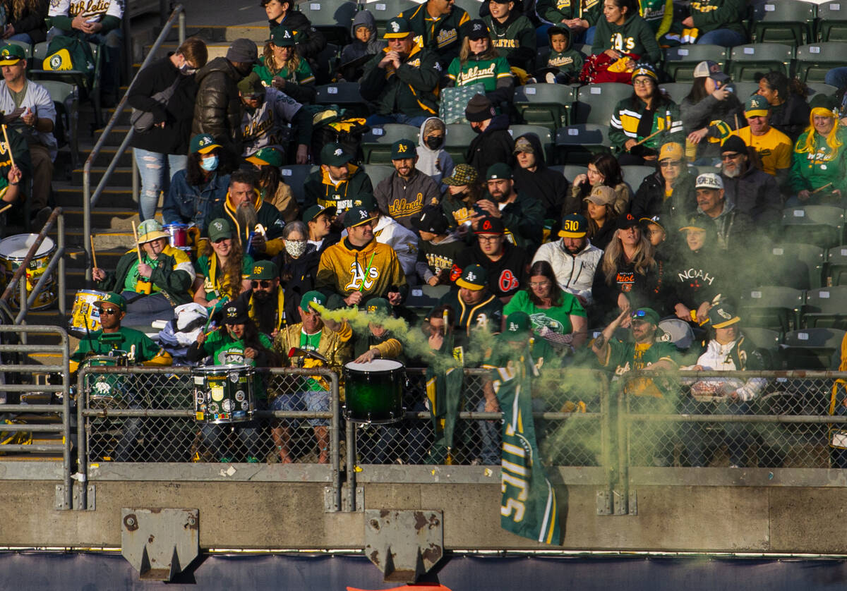 Oakland Athletics fans watch the opening night game against the Baltimore Orioles on Monday, Ap ...