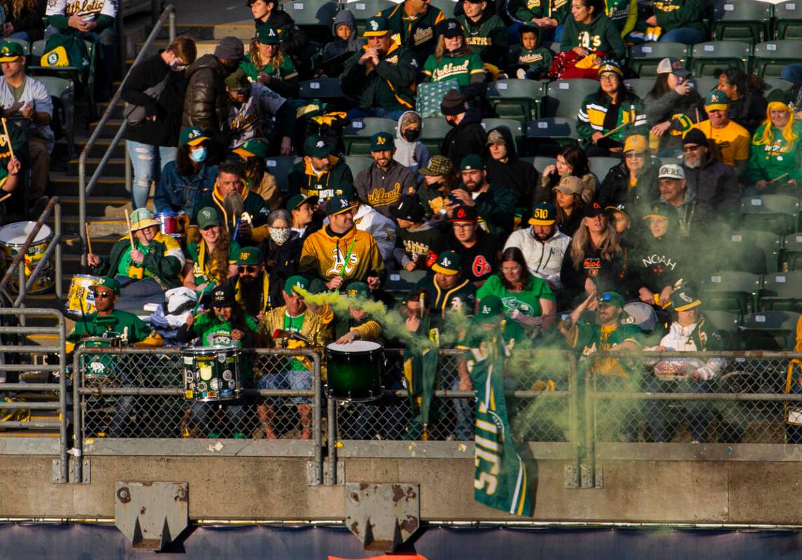 Oakland Athletics fans watch the opening night game against the Baltimore Orioles on Monday, Ap ...