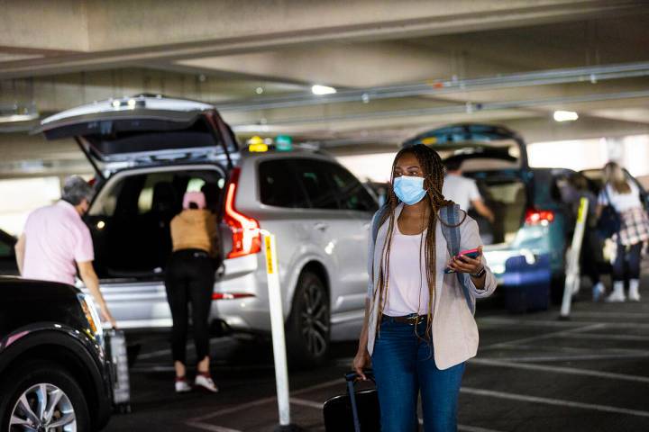 Passengers pick up their ride shares at Harry Reid International Airport on Tuesday, April 5, 2 ...
