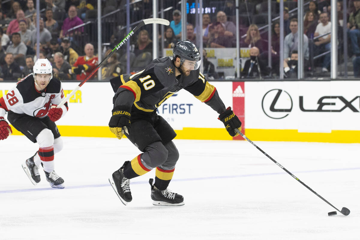 Golden Knights center Nicolas Roy (10) breaks away from New Jersey Devils defenseman Damon Seve ...