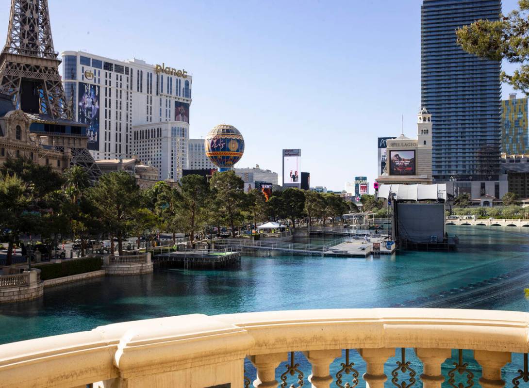 Workers install the red carpet stage on the Bellagio Fountains on Thursday, April 21, 2022, in ...