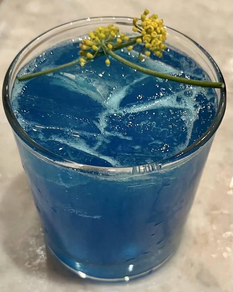 A Belvedere vodka cocktail, colored blue to honor Ukraine, was served at the fundraiser at Hone ...
