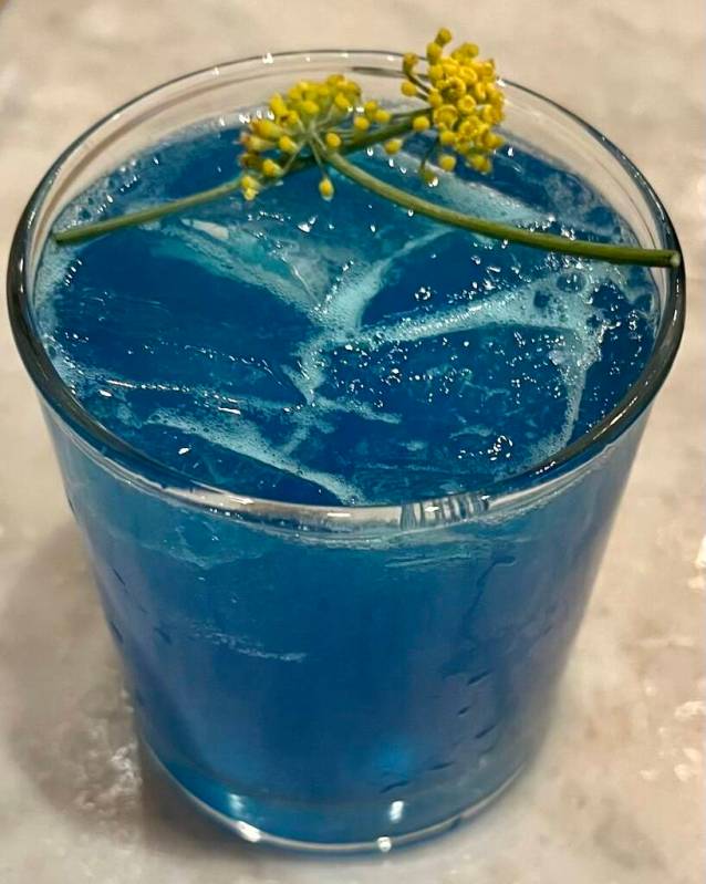 A Belvedere vodka cocktail, colored blue to honor Ukraine, was served at the fundraiser at Hone ...