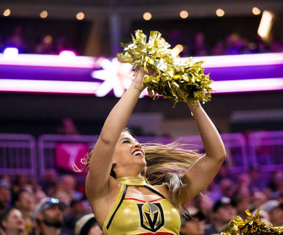 Golden Knights cheerleaders fire up the crowd during an NHL hockey game against the Washington ...