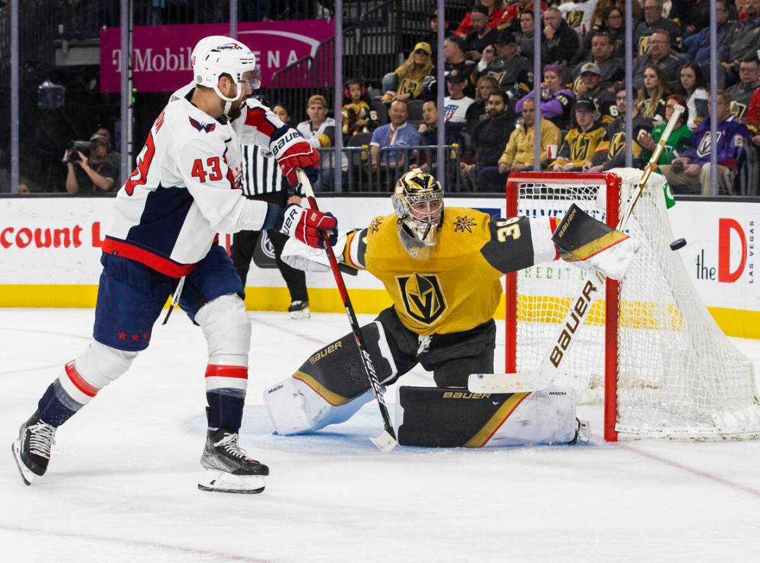 Golden Knights goaltender Logan Thompson (36) makes a save against Washington Capitals right wi ...