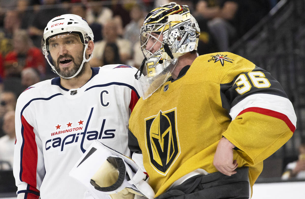 Golden Knights goaltender Logan Thompson (36) talks with Washington Capitals left wing Alex Ove ...