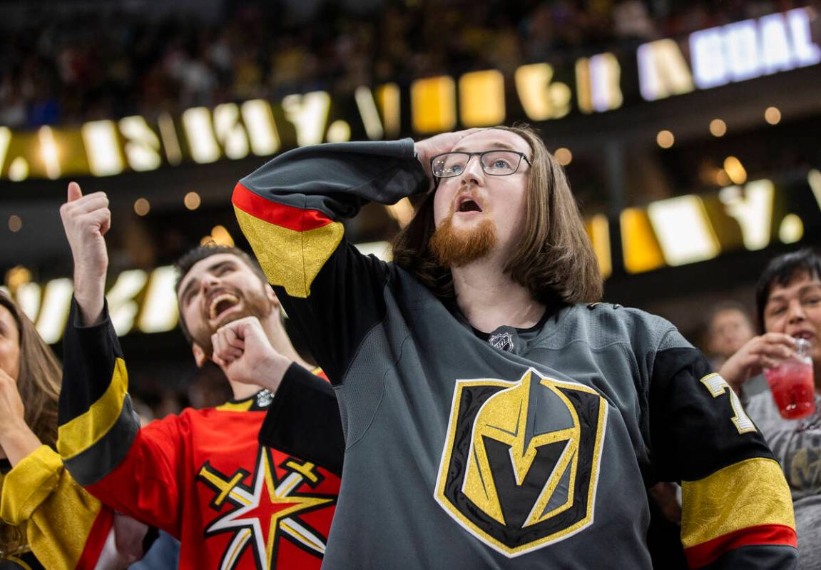 Golden Knights fans cheer for Vegas during an NHL hockey game against the Washington Capitals o ...