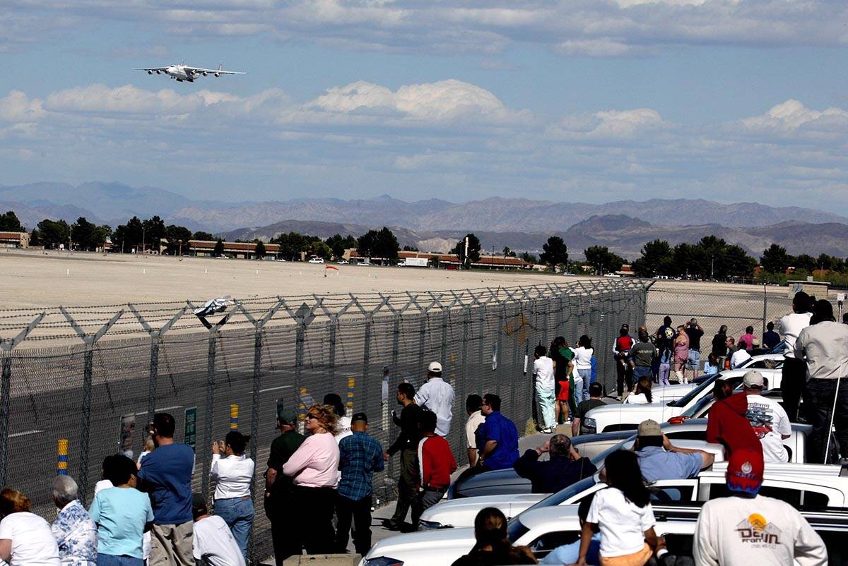 Crowds of spectators on the Sunset Road airport viewing area watch as a Antonov Airlines AN-225 ...