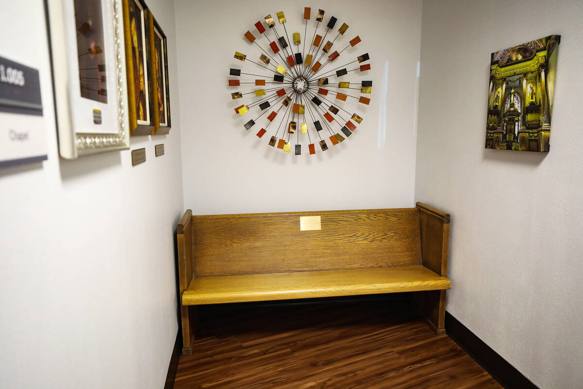 A pew from the original chapel sits in the hallway at Dignity Health St. Rose de Lima campus in ...