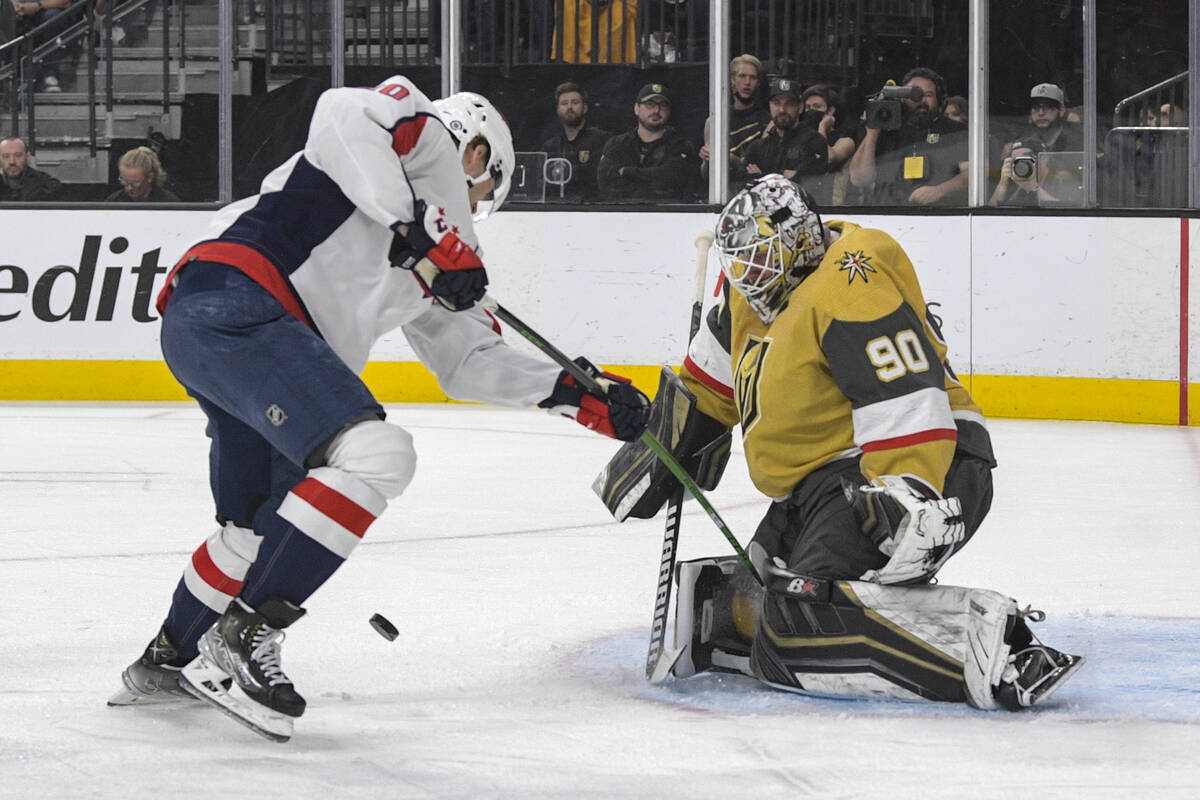 Vegas Golden Knights goaltender Robin Lehner (90) stops a shot by Washington Capitals center La ...