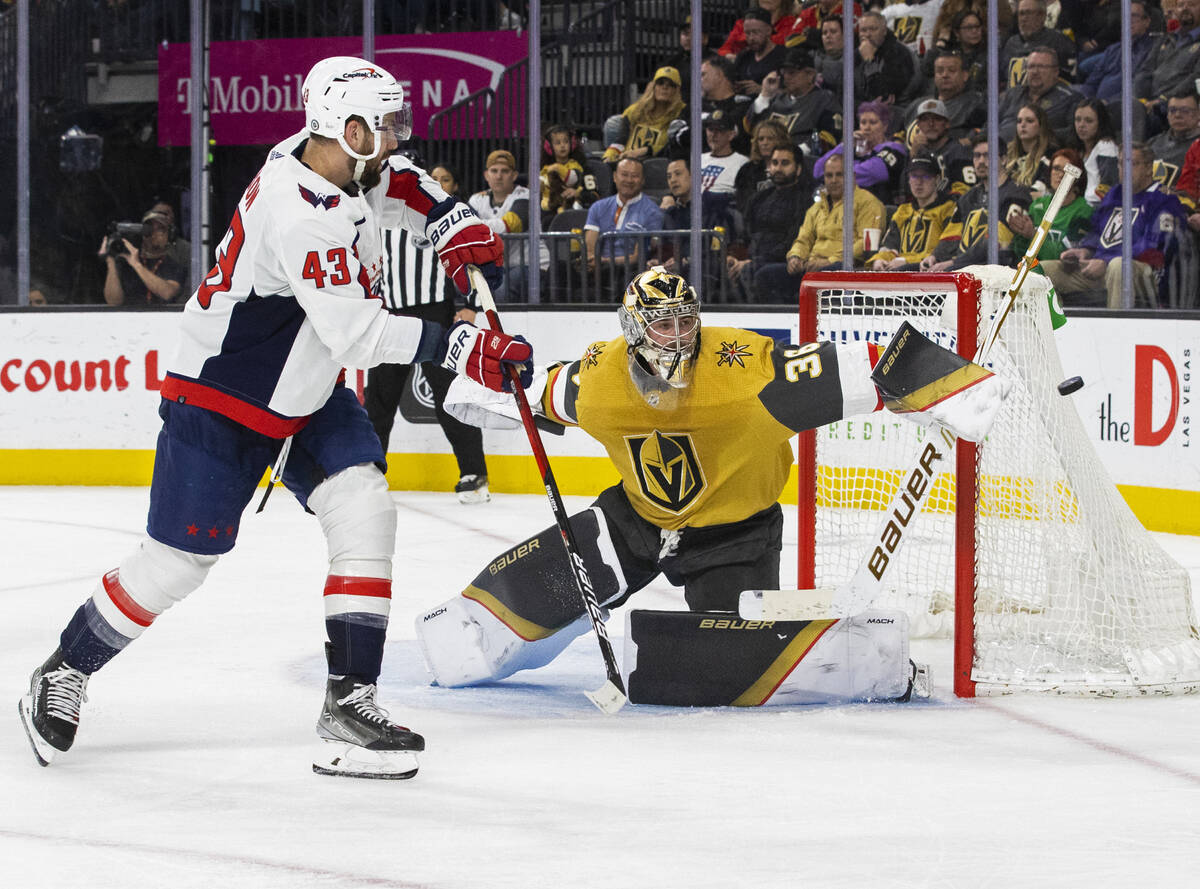 Golden Knights goaltender Logan Thompson (36) makes a save against Washington Capitals right wi ...