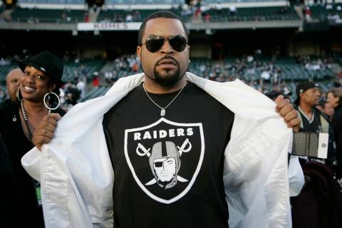 Rapper Ice Cube flashes his Raiders t-shirt at the NFL football game between the Oakland Raider ...