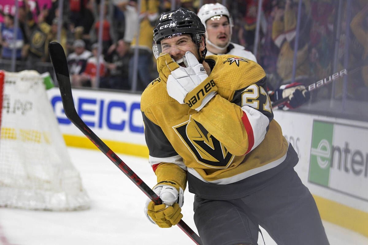 Vegas Golden Knights defenseman Shea Theodore (27) reacts after scoring in overtime against the ...