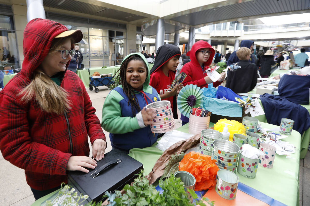 Roundy Elementary School students work at their booth, Friday, April 22, 2022, during the Stude ...