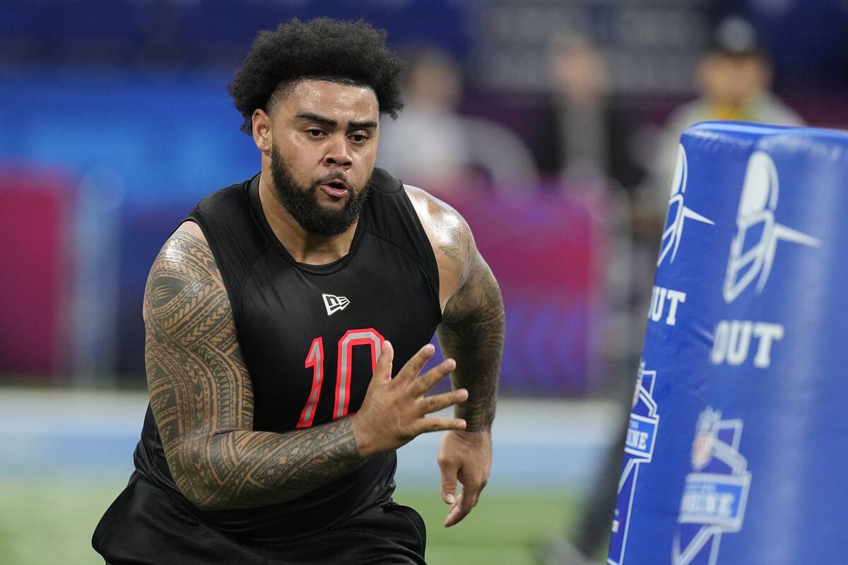 Ohio State defensive lineman Haskell Garrett runs a drill during the NFL football scouting comb ...