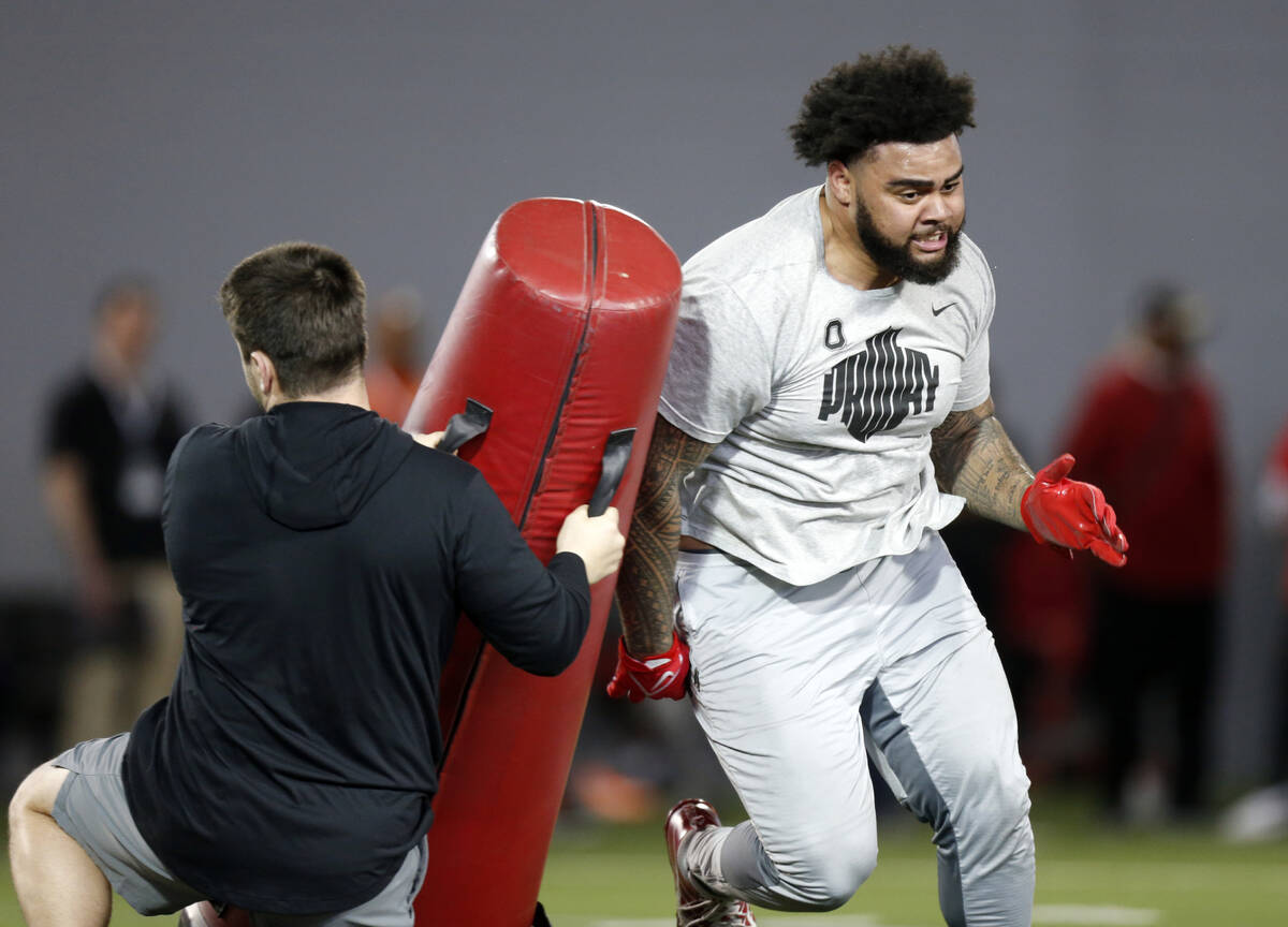 Defensive tackle Haskell Garrett runs a football drill during Ohio State Pro Day in Columbus, O ...