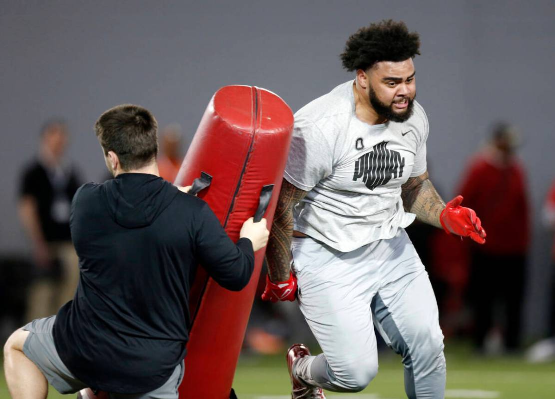 Defensive tackle Haskell Garrett runs a football drill during Ohio State Pro Day in Columbus, O ...