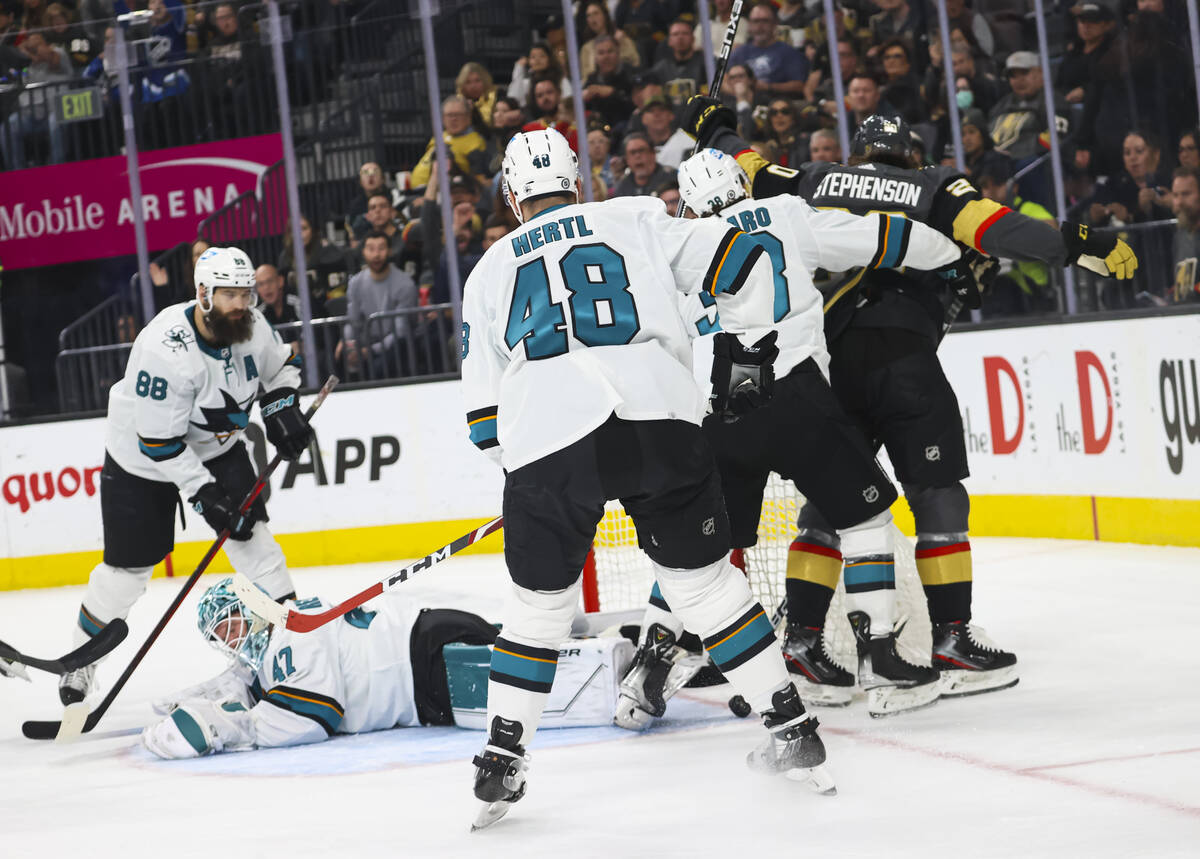 Golden Knights center Chandler Stephenson (20) scores against San Jose Sharks goaltender James ...