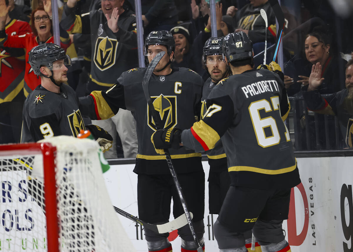 Golden Knights center Chandler Stephenson, third from left, reacts with teammates after his goa ...