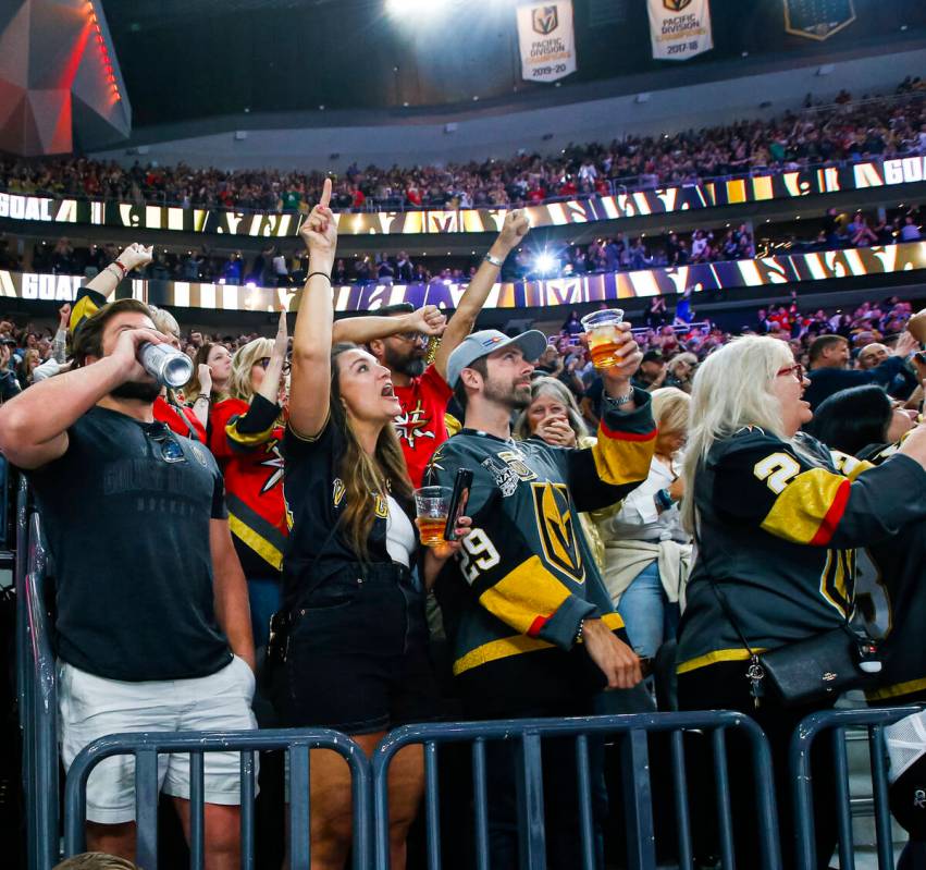 Golden Knights fans celebrate a goal against the San Jose Sharks during the second period of an ...