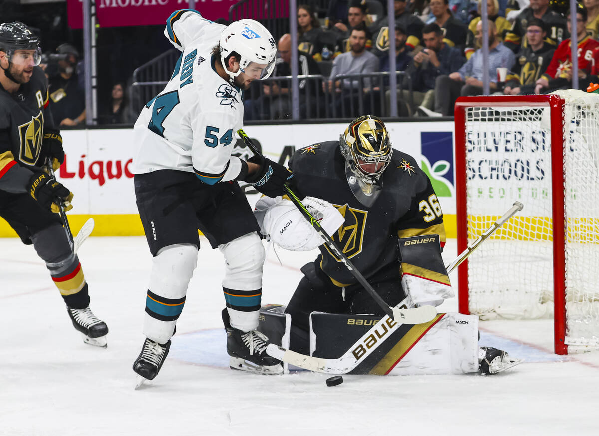 Golden Knights goaltender Logan Thompson (36) blocks a shot from San Jose Sharks center Scott R ...