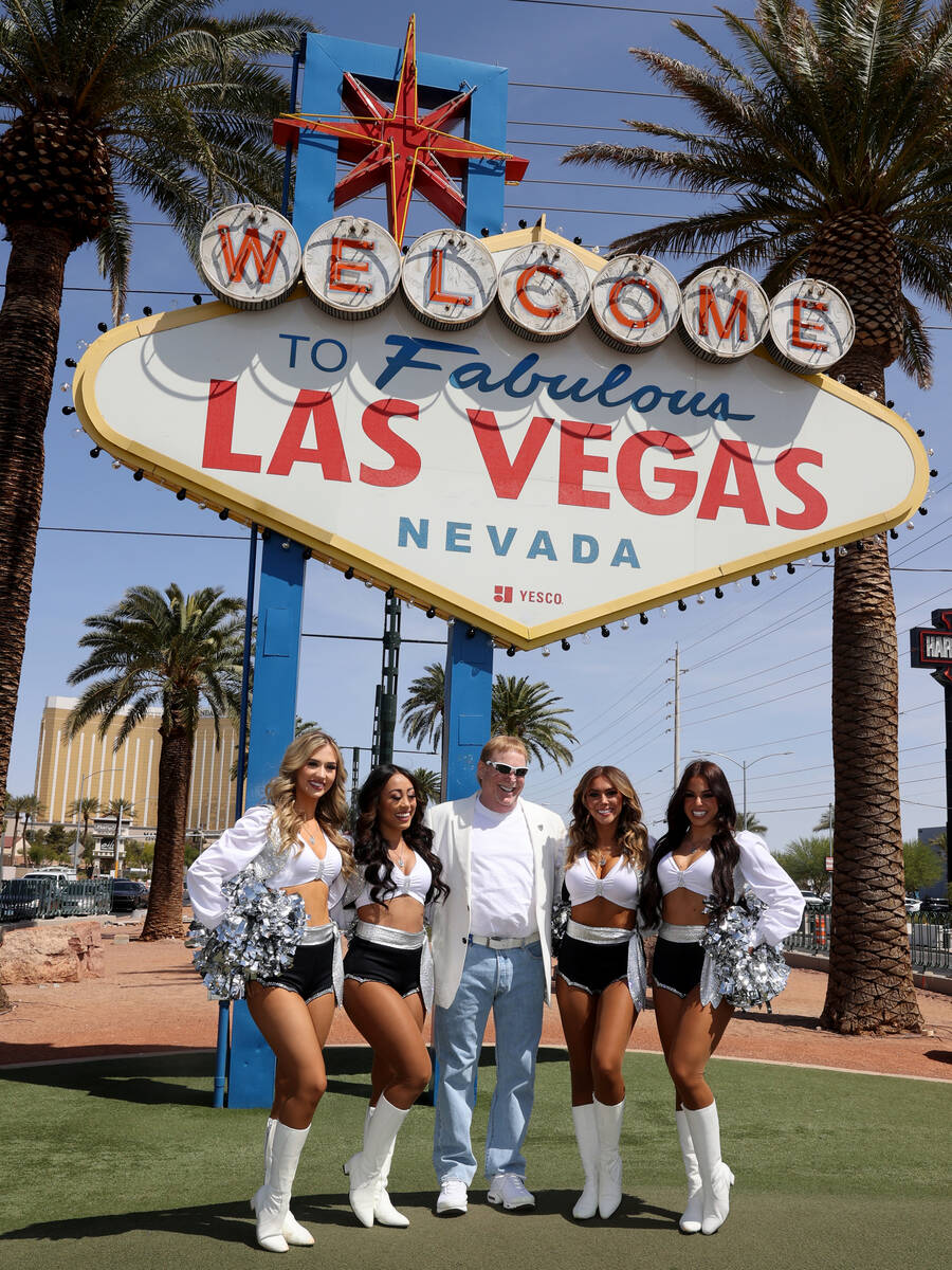 Raiders owner Mark Davis, center, poses with Raiderettes at the Welcome to Fabulous Las Vegas s ...