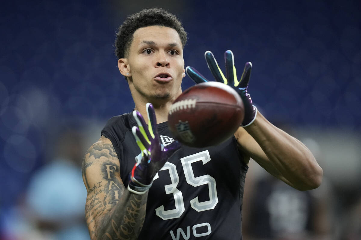 North Dakota State wide receiver Christian Watson catches a pass during a drill at the NFL foot ...