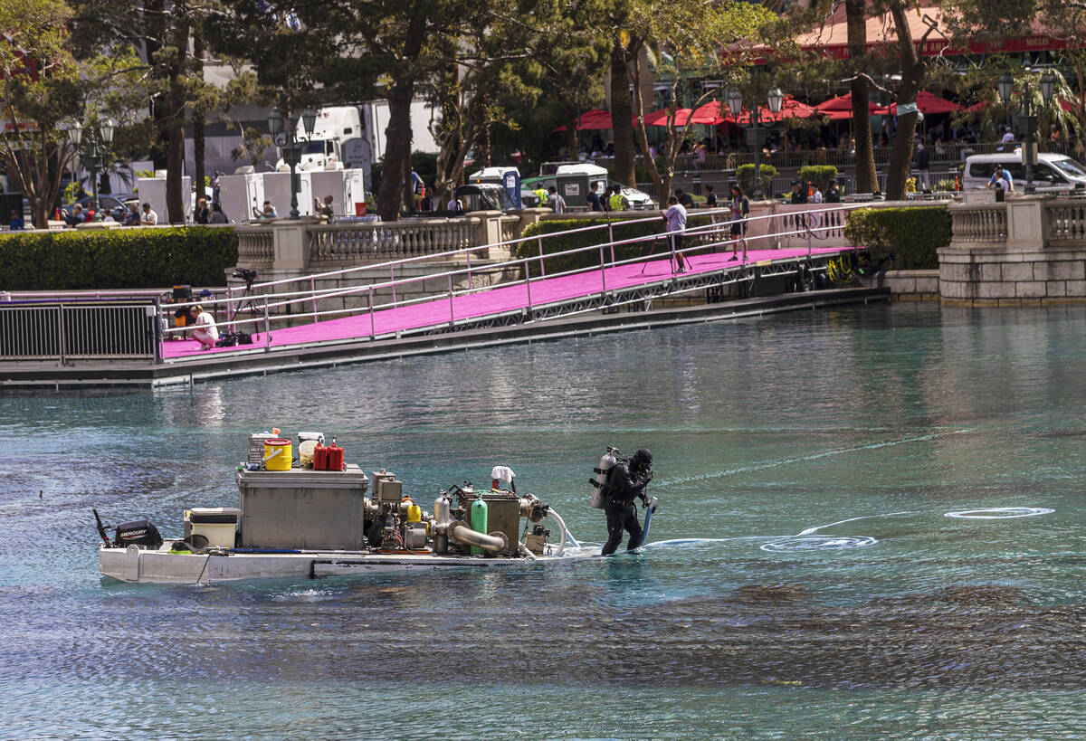 Divers work in the Bellagio Fountains near the NFL Draft Red Carpet Stage on Tuesday, April 26, ...