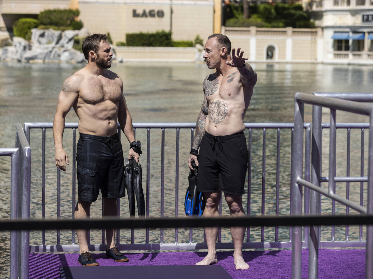 Divers work at the NFL Draft Red Carpet Stage at the Bellagio Fountains on Tuesday, April 26, ...