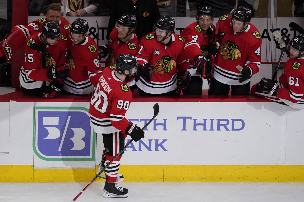 Chicago Blackhawks center Tyler Johnson (90) celebrates with teammates after scoring goal in a ...