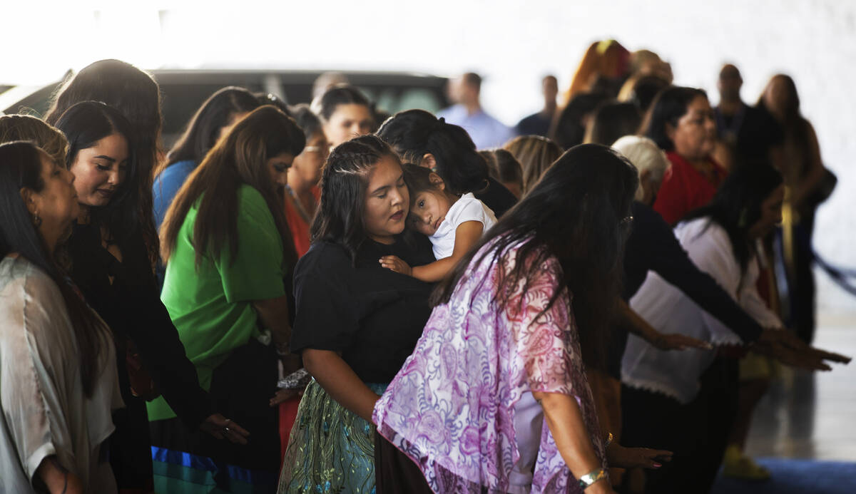 Tribal members participate in a ceremony with the Moapa Band of Paiute and San Manuel Band of M ...