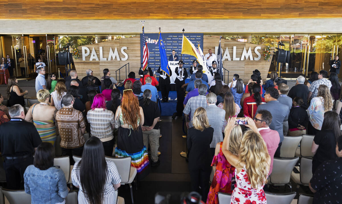 Carnell “Golden Pipes” Johnson, top/right, sings the national anthem during the r ...