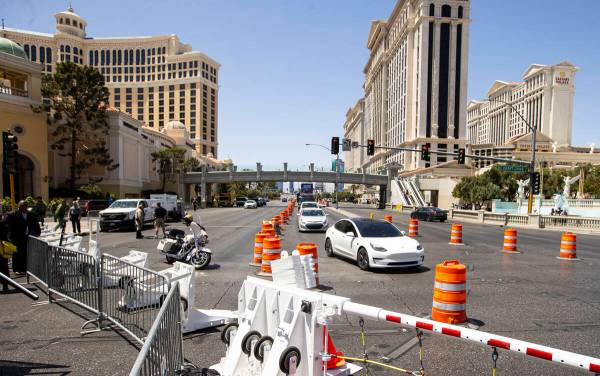 Vehicles pass by the intersection of Las Vegas Boulevard and Flamingo Road during the first day ...