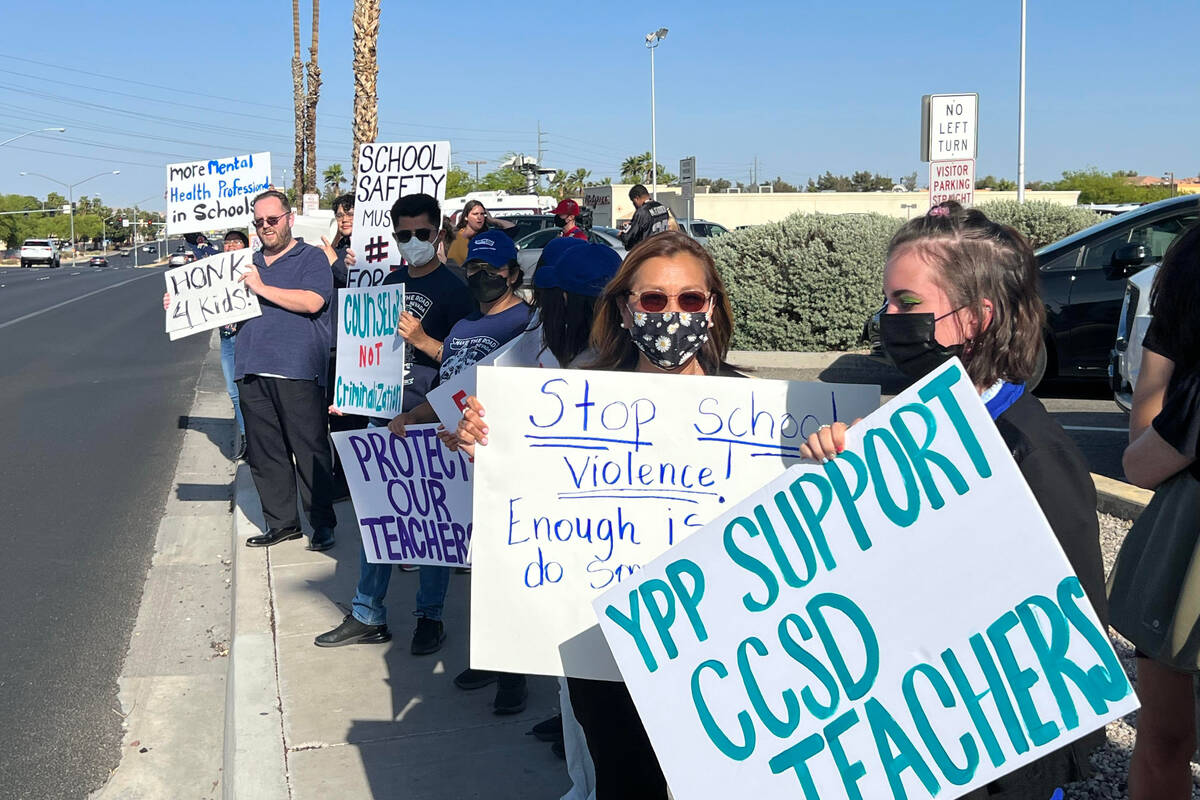 Two dozen educators, students and community members gather outside the Clark County School Dist ...