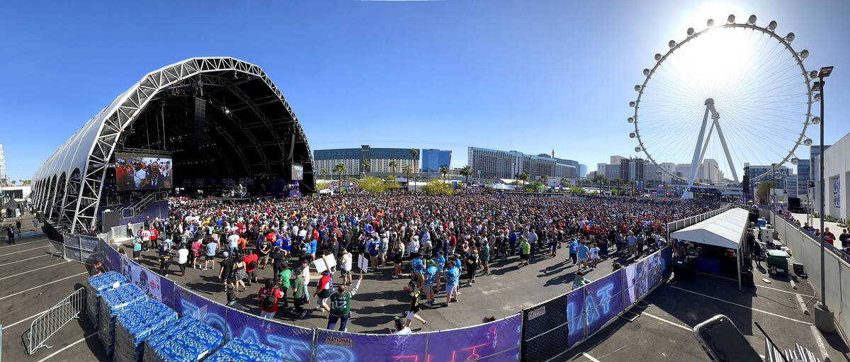 A crowd gathers to watch the start of the 2022 NFL Draft from the Draft Theater within the Draf ...