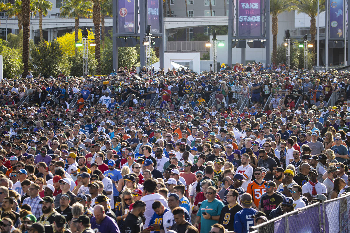 Fans cheer at the start of the first round of the NFL draft on Thursday, April 28, 2022, in Las ...