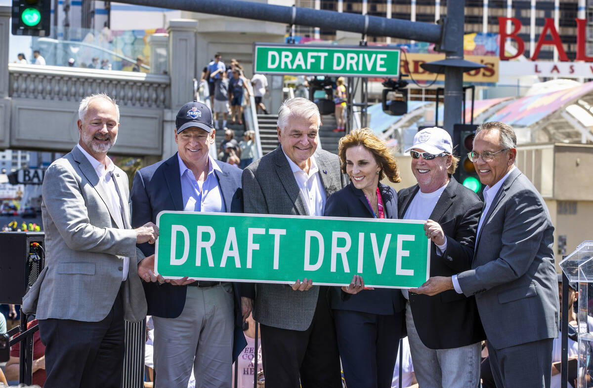 (From left) LVCVA President and CEO Steve Hill, NFL Commissioner Roger Goodell, Governor Steve ...